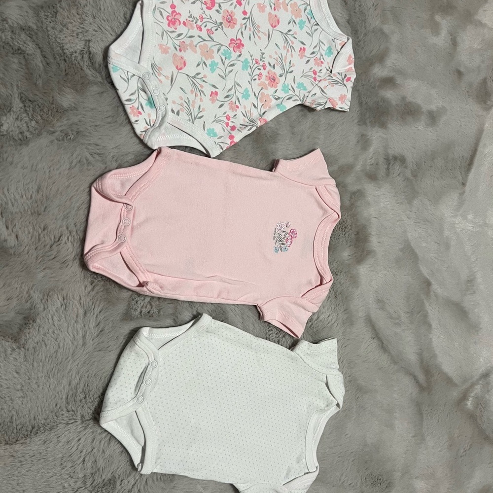 A set of 3 NB onesies by Little Me